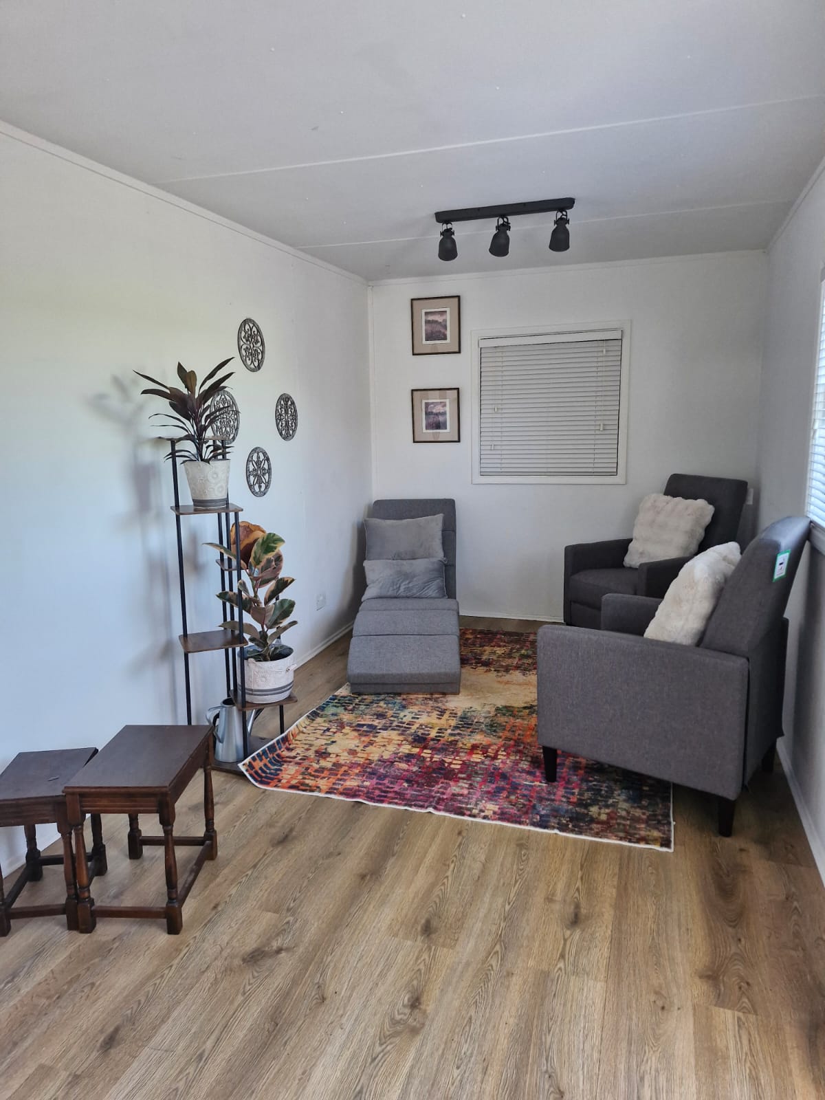 A cozy, decorated room with modern furniture